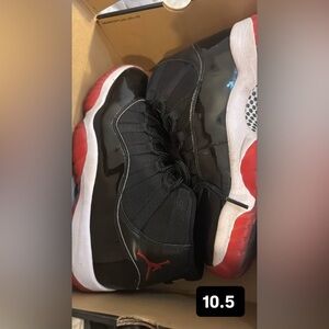 Jordan 11 Retro Black and Red Sneakers